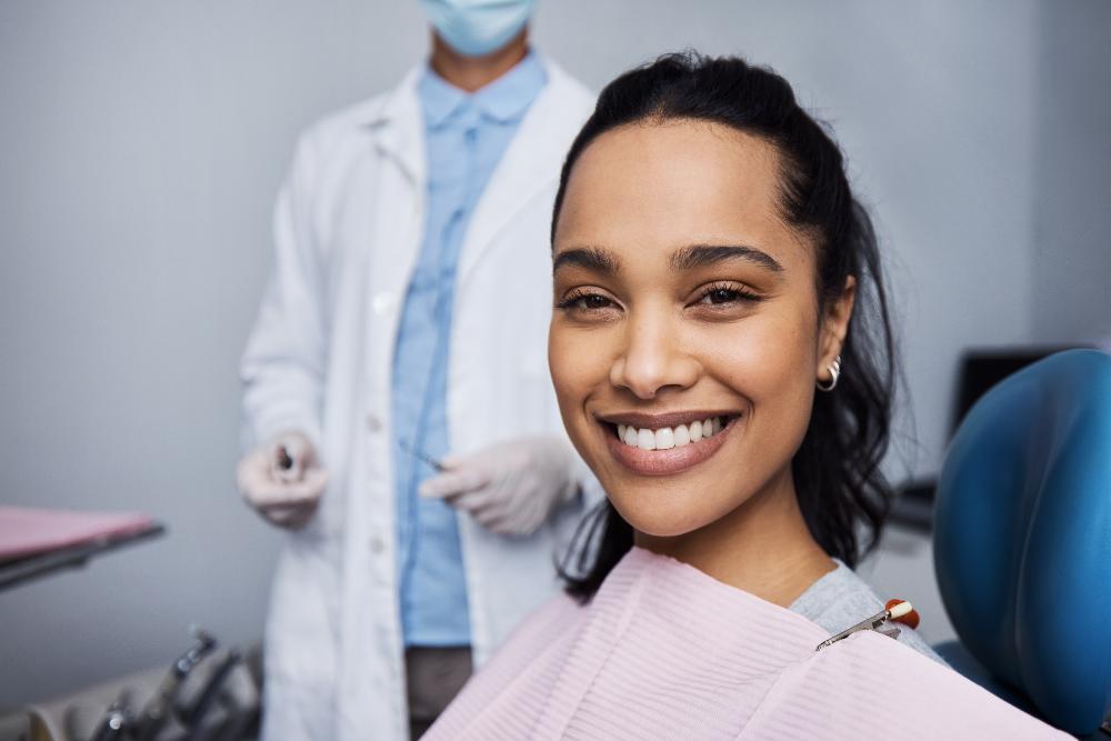 A smiling woman getting a dental exam