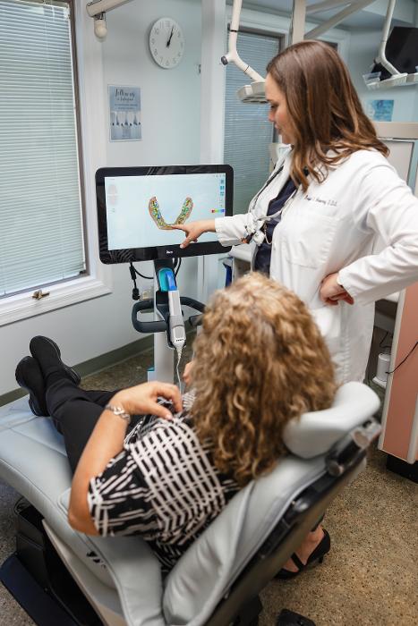 Dr Mooney showing a patient their digital dental impressions