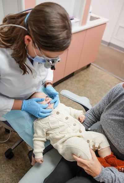 Dr Mooney doing a baby's dental exam