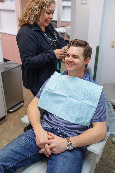 A smiling patient at Clarendon Family Dentistry in Arlington, VA