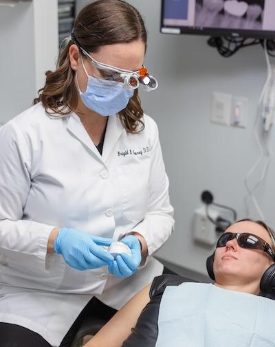 Dr Mooney holding a dental mold