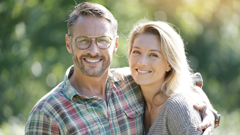 A smiling couple in the park
