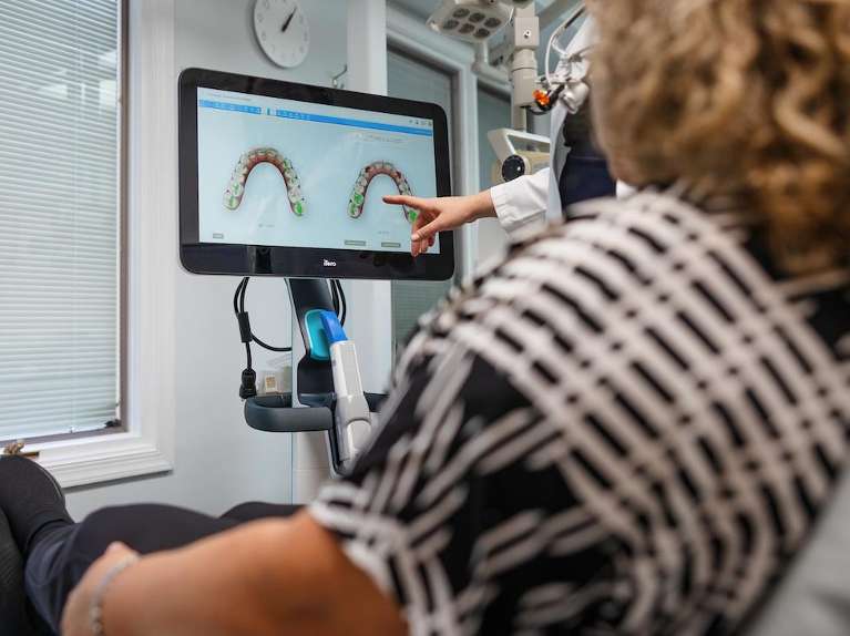 A dentist using an iTero digital scanner